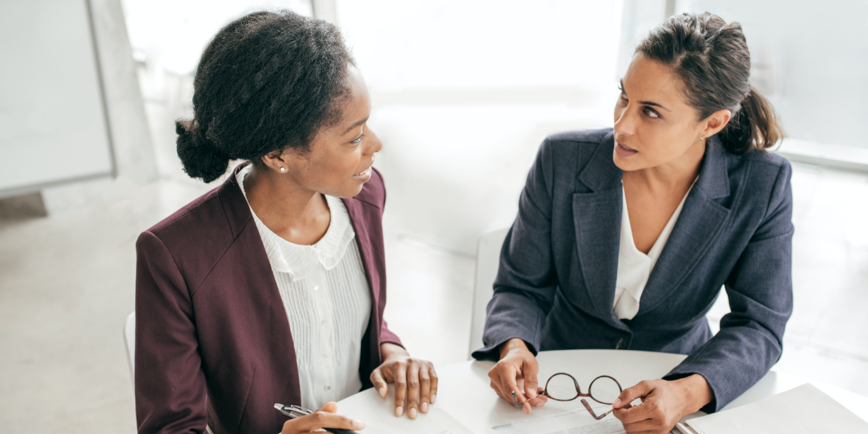 two businesswomen talking to each other