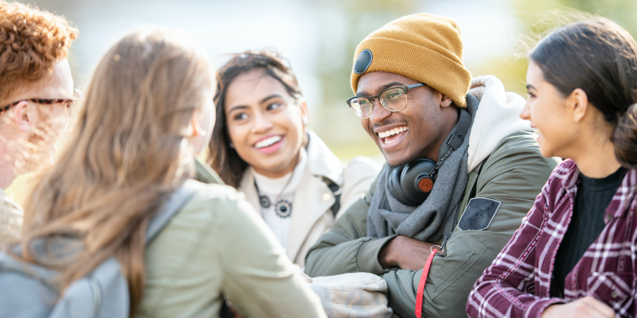 group of teens laughing together